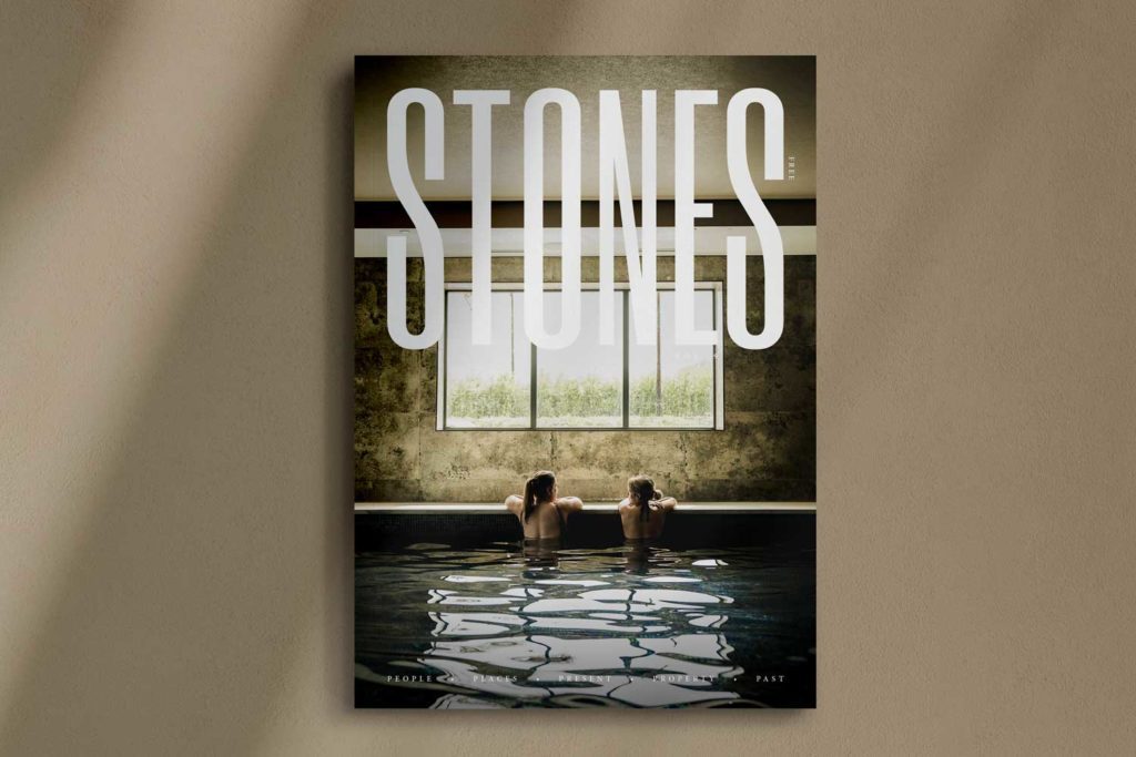 Photo of STONES volume 9 front cover on beige background